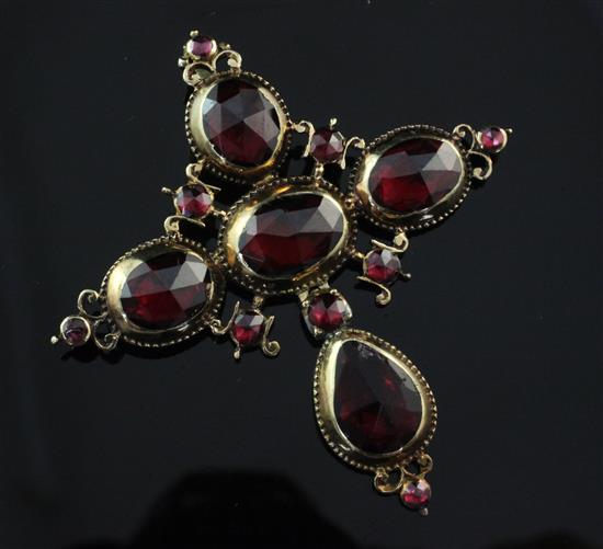 A Victorian gold and foil backed garnet cruciform pendant, 2.5in.